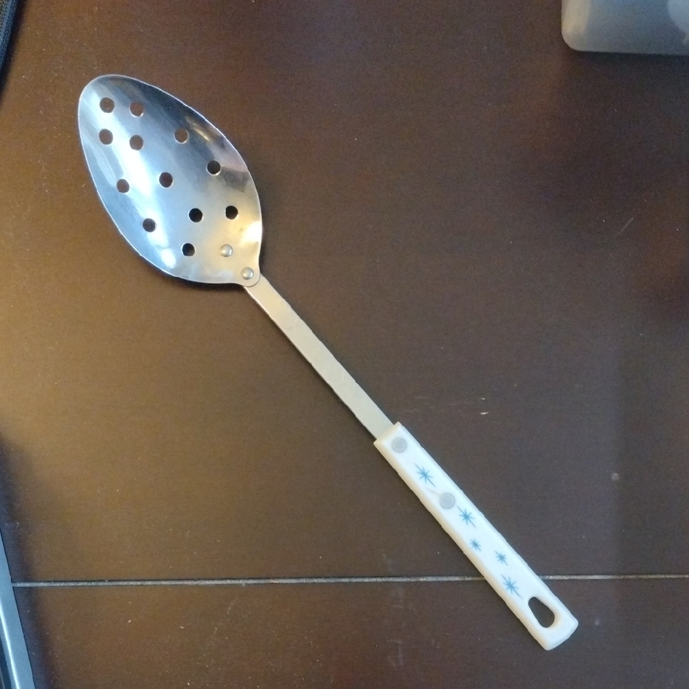 Silver Slotted Serving Spoon with White Handle